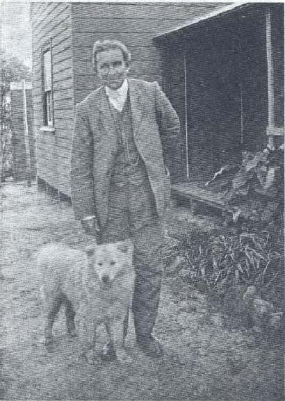 Professor Edgeworth David in 1910, with Ambrose, the sledge-dog lineally descendant from the Siberian wolf.